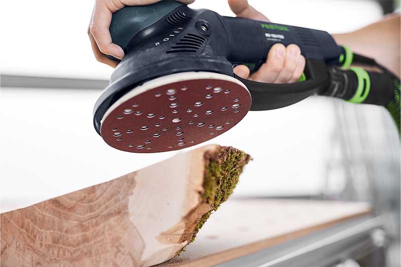 A piece of wood is sanded with a Rotex sander and matching Rubin abrasive