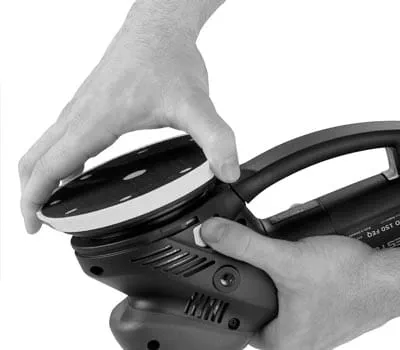 Preliminary sanding of the mineral material panel in coarse sanding setting with cross sanding