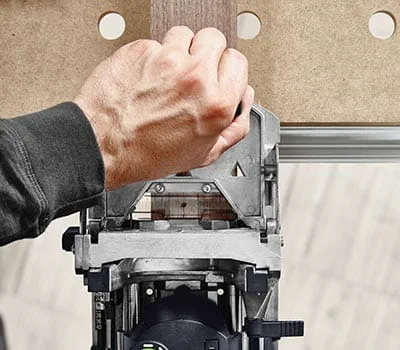 The second routed hole is set here using the stop catch