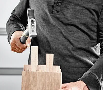 Chamfer the cut dowel at the edges using a sanding block.