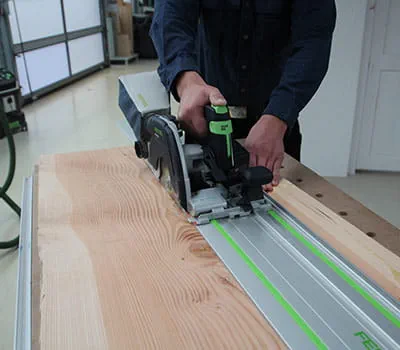 Sawing and cutting a floorboard to length