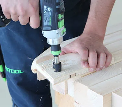 Pre-drilling the wooden butt straps