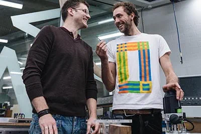 Two carpenter are talking about their new projects