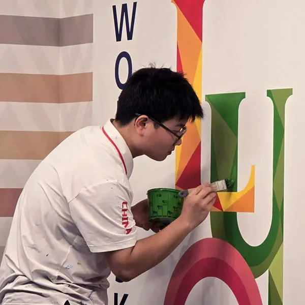 Chinese painter Xiaofei Zhang at work
